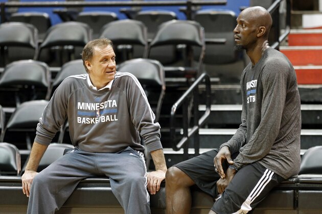 Minnesota Timberwolves star Kevin Garnett, right, talks with head coach Flip Saunders after his first practice upon his return to the former team that originally drafted him out of high school, Tuesday, Feb. 24, 2015, in Minneapolis. Garnett waived his no-trade clause with the Brooklyn Nets to return to Minnesota. (AP Photo/Jim Mone)