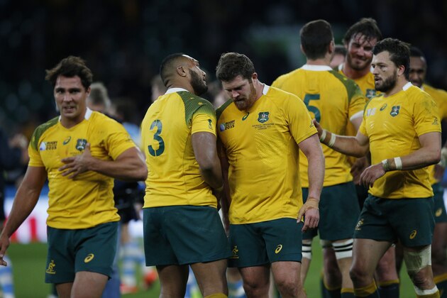 Australian player's celebrate their 29-15 win over Argentina in their Rugby World Cup semifinal match at Twickenham Stadium, London, Sunday, Oct. 25, 2015. (AP Photo/Christophe Ena)