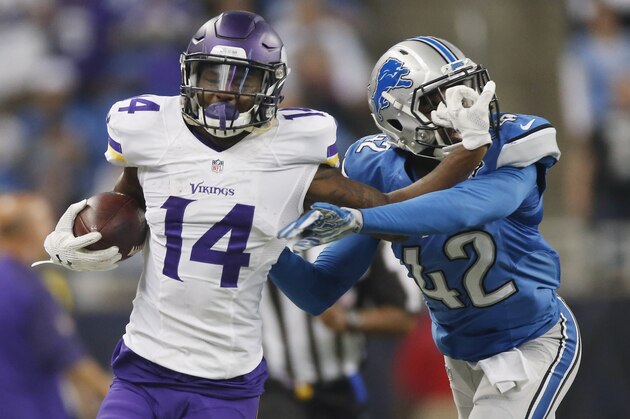 DETROIT, MI - OCTOBER 25: Stefon Diggs #14 of the Minnesota Vikings runs the ball in the second quarter while being defended by Isa Abdul-Quddus #42 of the Detroit Lions at Ford Field on October 25, 2015 in Detroit, Michigan. (Photo by Gregory Shamus/Getty Images)