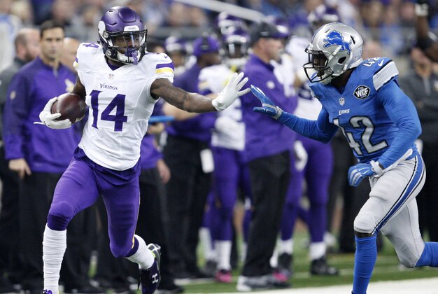 Oct 25, 2015; Detroit, MI, USA; Minnesota Vikings wide receiver Stefon Diggs (14) carries the ball as Detroit Lions strong safety Isa Abdul-Quddus (42) chases during the second quarter at Ford Field. Mandatory Credit: Raj Mehta-USA TODAY Sports