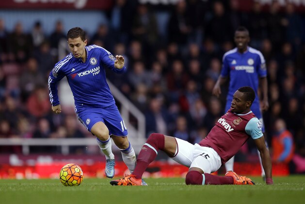 West Ham's Diafra Sakho, right, competes for the ball with Chelsea's Eden Hazard during the English Premier League soccer match between West Ham and Chelsea at Upton Park stadium in London, Saturday, Oct. 24, 2015.  (AP Photo/Matt Dunham)