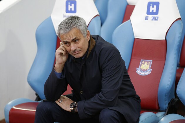 Chelsea's head coach Jose Mourinho waits for the match to start after taking his seat pitchside before his staff and substitutes came out before the English Premier League soccer match between West Ham and Chelsea at Upton Park stadium in London, Saturday, Oct. 24, 2015.  (AP Photo/Matt Dunham)