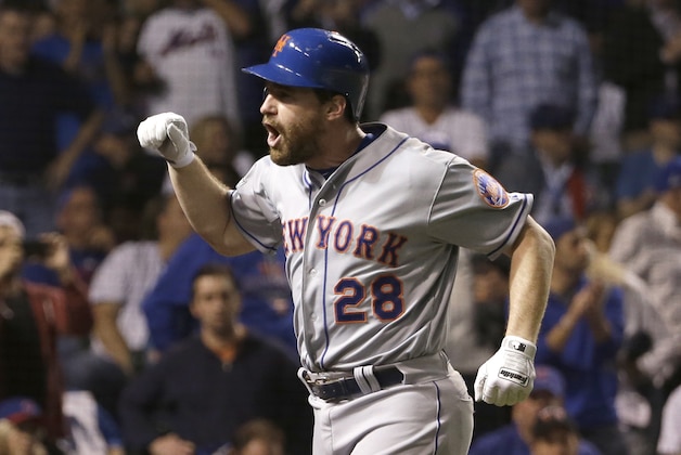 New York Mets' Daniel Murphy celebrates after hitting a two-run home run during the eighth inning of Game 4 of the National League baseball championship series against the Chicago Cubs Wednesday, Oct. 21, 2015, in Chicago. (AP Photo/David J. Phillip)