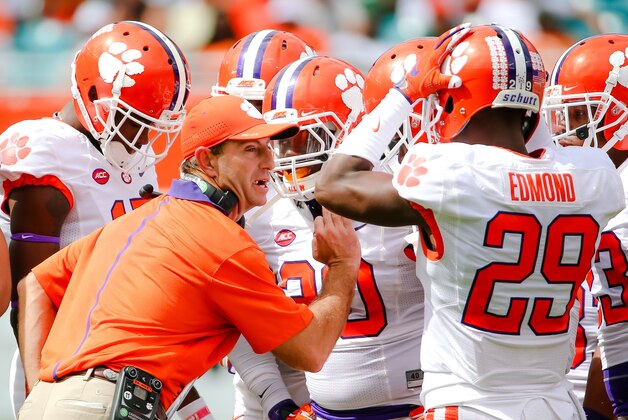 Oct 24, 2015; Miami Gardens, FL, USA; Clemson Tigers head coach Dabo Swinney talks with his players during the first half against the Miami Hurricanes at Sun Life Stadium. Mandatory Credit: Steve Mitchell-USA TODAY Sports