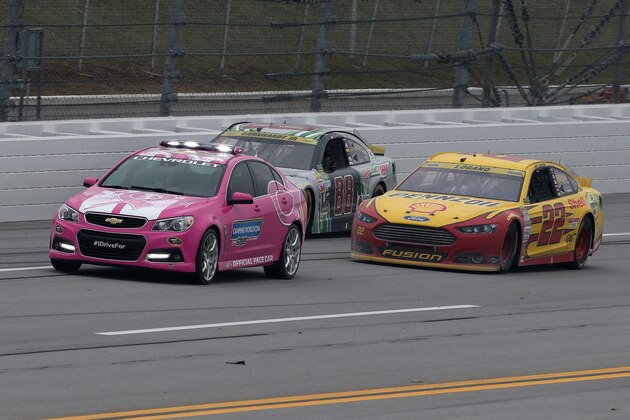 TALLADEGA, AL - OCTOBER 25:  Joey Logano, driver of the #22 Shell Pennzoil Ford, leads Dale Earnhardt Jr., driver of the #88 Diet Mountain Dew Chevrolet, under caution on the final lap during the NASCAR Sprint Cup Series CampingWorld.com 500 at Talladega Superspeedway on October 25, 2015 in Talladega, Alabama.  (Photo by Todd Warshaw/Getty Images)
