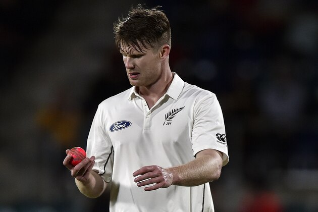 New Zealand pacemen James Neesham looks at the ball as he prepares to bowl during a limited overs cricket match between New Zealand and Australia's Prime Minister's XI in Canberra on October 23, 2015. AFP PHOTO / Saeed KHAN
IMAGE STRICTLY RESTRICTED TO EDITORIAL USE - STRICTLY NO COMMERCIAL USE        (Photo credit should read SAEED KHAN/AFP/Getty Images)