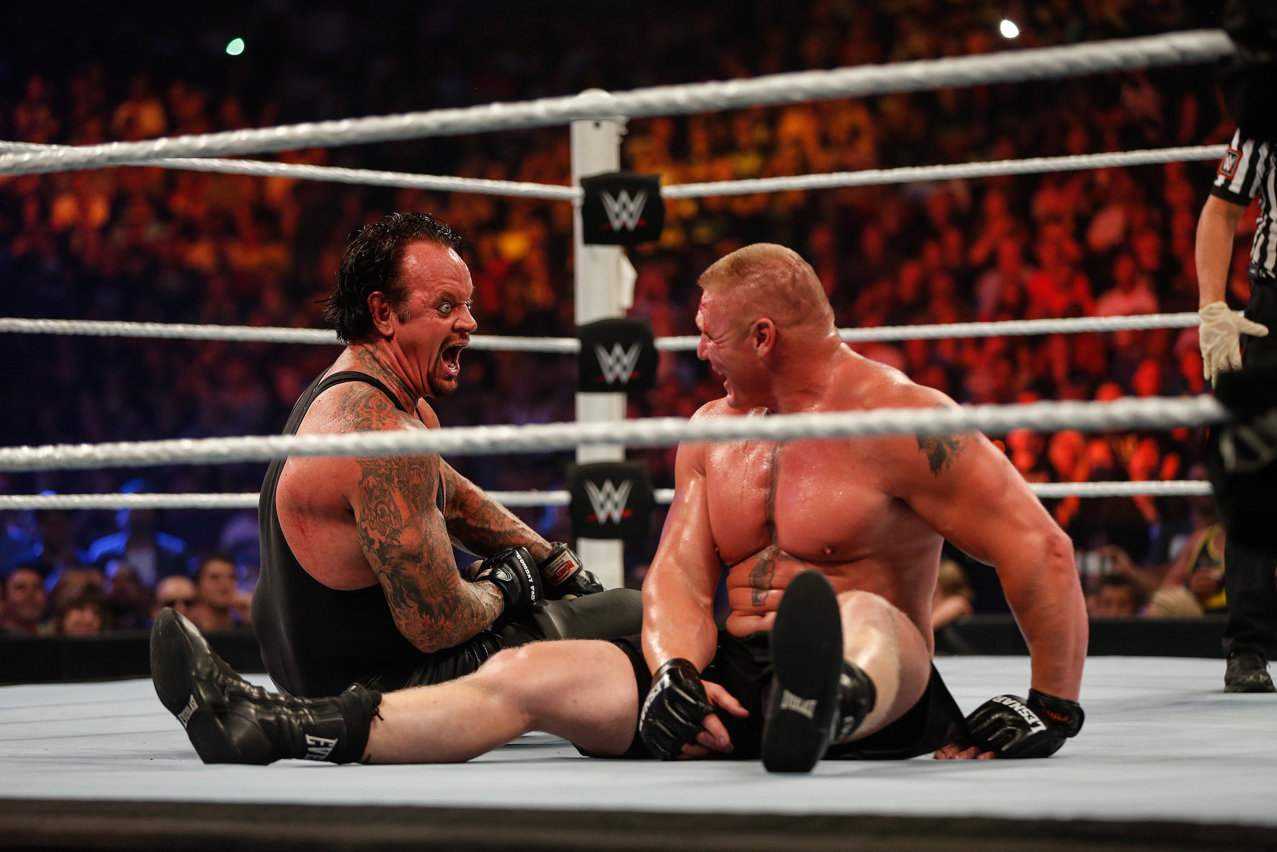 NEW YORK, NY - AUGUST 23:  Brock Lesnar and The Undertaker battle it out at the WWE SummerSlam 2015 at Barclays Center of Brooklyn on August 23, 2015 in New York City.  (Photo by JP Yim/Getty Images)