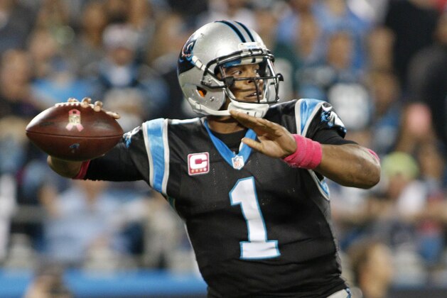 Carolina Panthers' Cam Newton (1) looks to pass against the Philadelphia Eagles in the first half of  an NFL football game in Charlotte, N.C., Sunday, Oct. 25, 2015. (AP Photo/Bob Leverone)