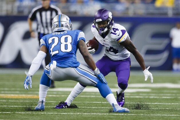 Minnesota Vikings wide receiver Stefon Diggs (14) rushes at Detroit Lions cornerback Quandre Diggs (28) during an NFL football game, Sunday, Oct. 25, 2015, in Detroit. (AP Photo/Rick Osentoski)