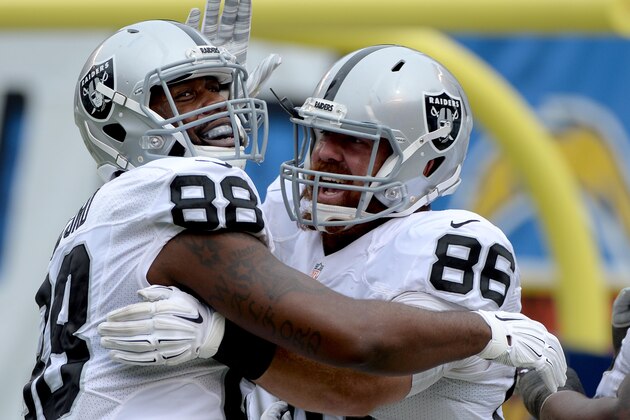SAN DIEGO - OCTOBER 25:  Tight-End Clive Walford #88 is congratulated by teammate Lee Smith #86 of the Oakland Raiders after Walford's touchdown against the San Diego Chargers during their NFL game at Qualcomm Stadium on October 25, 2015 in San Diego, California. (Photo by Donald Miralle/Getty Images)