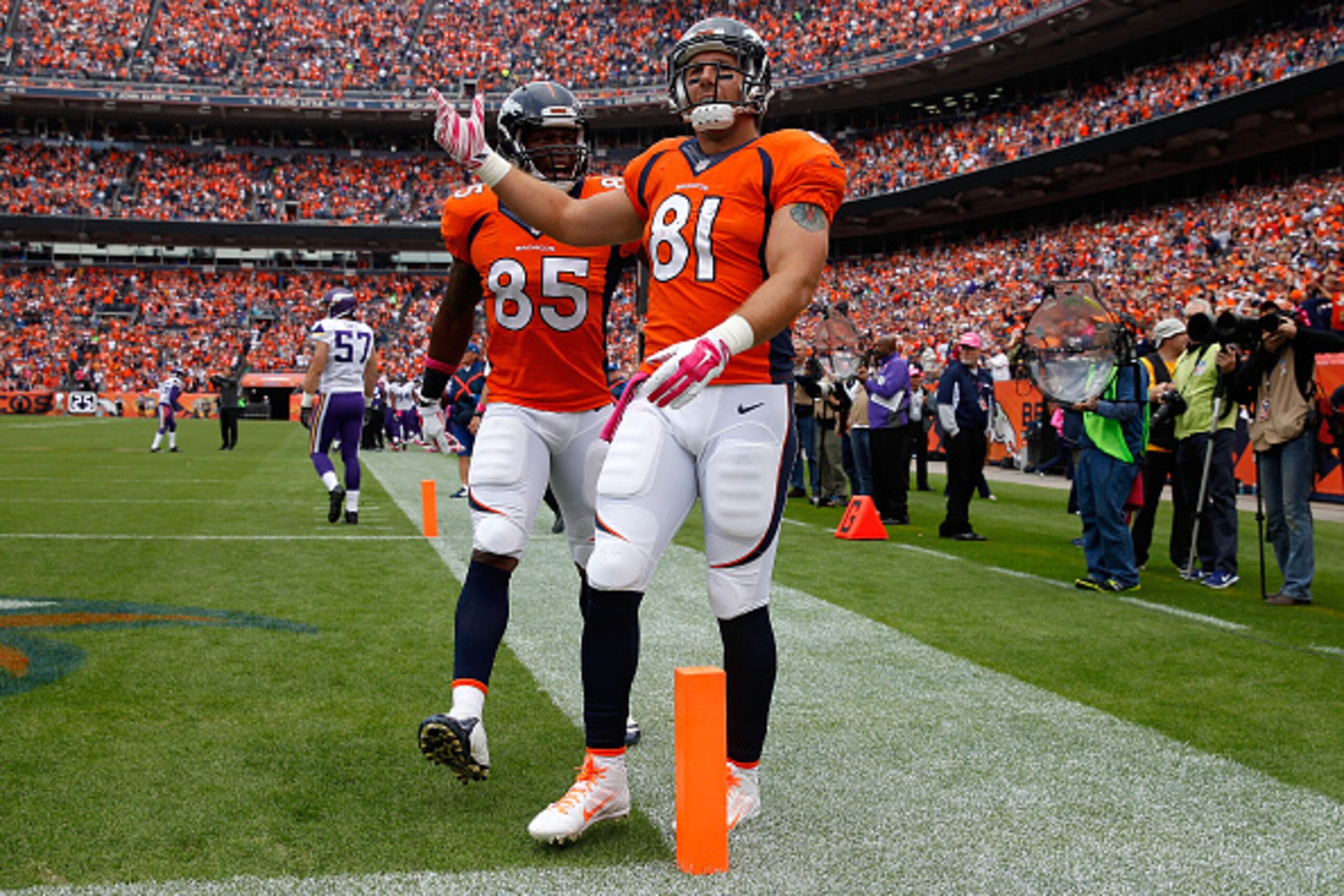 DENVER, CO - OCTOBER 04:  Tight end Owen Daniels #81 of the Denver Broncos celebrates his touchdown reception against the Minnesota Vikings with tight end Virgil Green #85 of the Denver Broncos at Sports Authority Field at Mile High on October 4, 2015 in Denver, Colorado. The Broncos defeated the Vikings 23-20.  (Photo by Doug Pensinger/Getty Images)