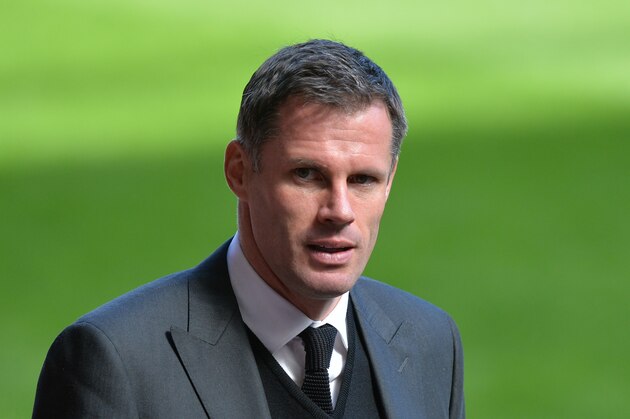 Retired Liverpool football club player Jamie Carragher arrives for a memorial service to mark the 25th anniversary of the Hillsborough Disaster at Anfield Stadium in Liverpool, northwest England on April 15, 2014. Thousands attended a service at Anfield football stadium in Liverpool as the city came to a standstill on April 15 to mark the 25th anniversary of the day 96 football fans were crushed to death in the Hillsborough stadium disaster when Liverpool played Nottingham Forest in an FA Cup tie in 1989. AFP PHOTO / PAUL ELLIS        (Photo credit should read PAUL ELLIS/AFP/Getty Images)