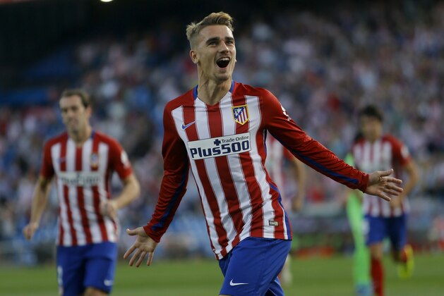 Atletico Madrid's Antoine Griezmann celebrates after scoring the opening goal against Getafe during a Spanish La Liga soccer match between Atletico Madrid and Getafe at the Vicente Calderon in Madrid, Tuesday, Sept. 22, 2015. (AP Photo/Francisco Seco)