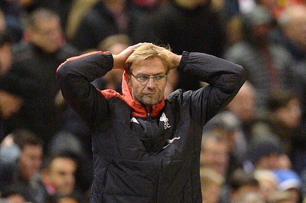 Liverpool's German manager Jurgen Klopp (L) reacts on the touchline as Southampton's Dutch manager Ronald Koeman (R) looks on during the English Premier League football match between Liverpool and Southampton at Anfield stadium in Liverpool, north west England on October 25, 2015. The game finished 1-1. AFP PHOTO / OLI SCARFF

RESTRICTED TO EDITORIAL USE. No use with unauthorized audio, video, data, fixture lists, club/league logos or 'live' services. Online in-match use limited to 75 images, no video emulation. No use in betting, games or single club/league/player publications.        (Photo credit should read OLI SCARFF/AFP/Getty Images)