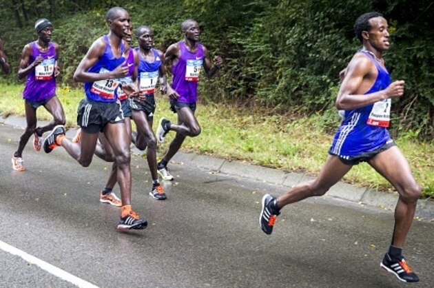 Kenyan runner Bernard Kipyego (3rdR) competes in the Amsterdam Marathon on his way to win the event in Amsterdam, on October 18, 2015. AFP PHOTO / ANP / JERRY LAMPEN  -- The Netherlands out --        (Photo credit should read JERRY LAMPEN/AFP/Getty Images)