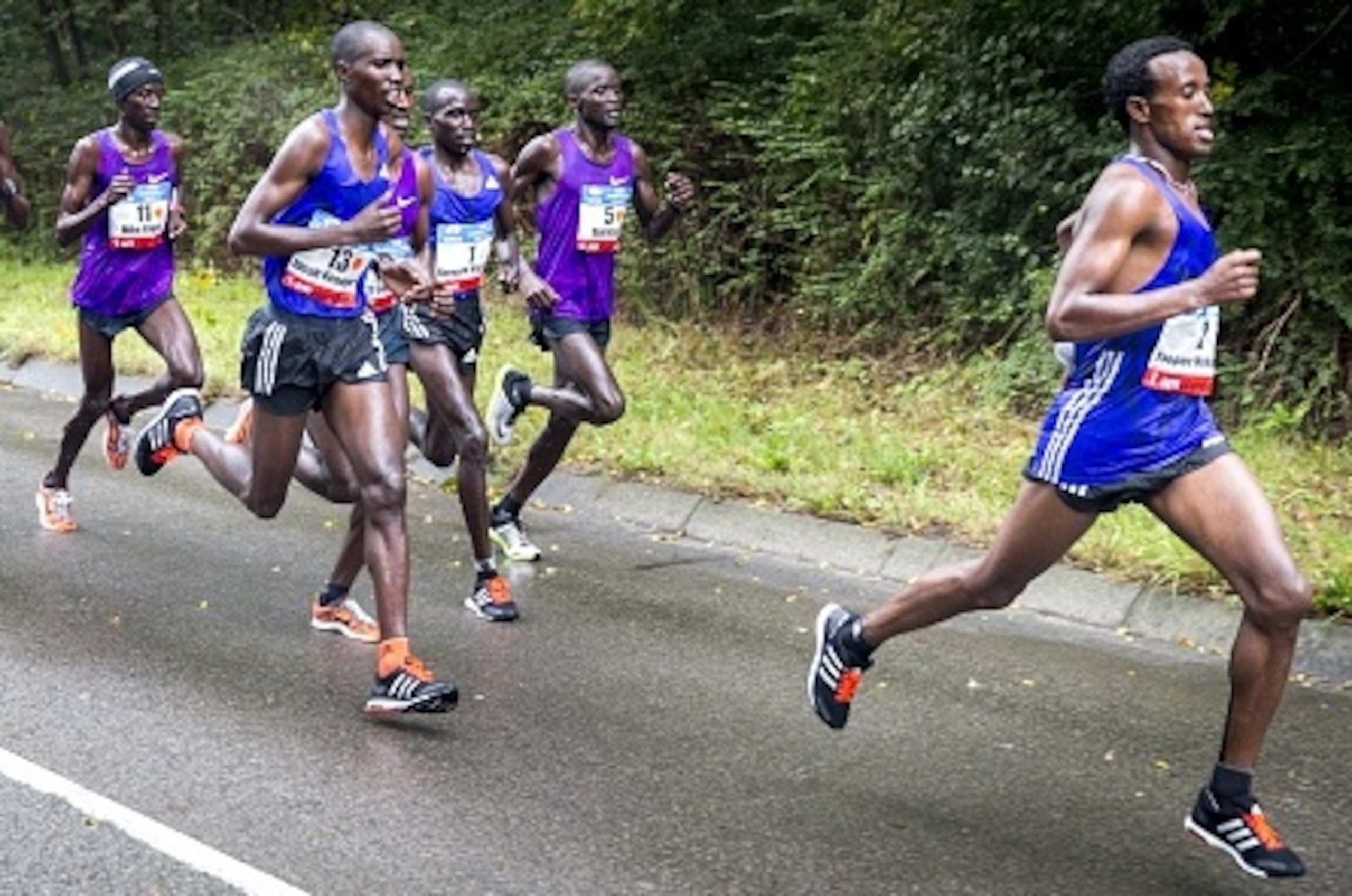 Kenyan runner Bernard Kipyego (3rdR) competes in the Amsterdam Marathon on his way to win the event in Amsterdam, on October 18, 2015. AFP PHOTO / ANP / JERRY LAMPEN  -- The Netherlands out --        (Photo credit should read JERRY LAMPEN/AFP/Getty Images)