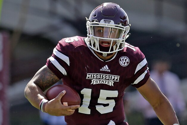 STARKVILLE MS -OCTOBER 17:  Quarterback Dak Prescott #15 of the Mississippi State Bulldogs scrambles for a first down during the second half of an NCAA college football game against the Louisiana Tech Bulldogs at Davis Wade Stadium on October 17, 2015 in Starkville, Mississippi. (Photo by Butch Dill/Getty Images)