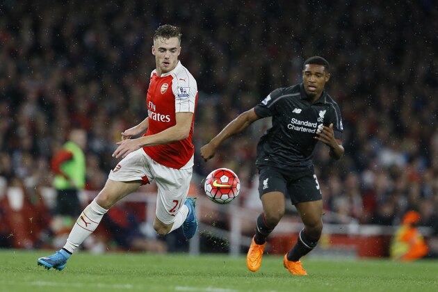 Arsenal's Calum Chambers, left, vies for the ball with Liverpool's Jordan Ibe during the English Premier League soccer match between Arsenal and Liverpool at Emirates stadium in London, Monday, Aug. 24, 2015. (AP Photo/Kirsty Wigglesworth)