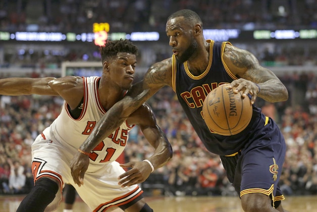 Cleveland Cavaliers forward LeBron James (23) drives on Chicago Bulls guard Jimmy Butler (21) during the first half of Game 6 in a second-round NBA basketball playoff series in Chicago on Thursday, May 14, 2015. (AP Photo/Nam Y. Huh)