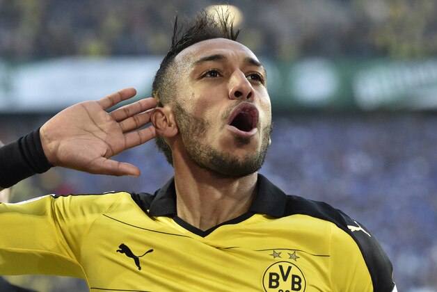 Dortmund's Pierre-Emerick Aubameyang celebrates after scoring his second goal during the German Bundesliga soccer match between Borussia Dortmund and SV Darmstadt in Dortmund, Germany, Sunday, Sept. 27, 2015. (AP Photo/Martin Meissner)