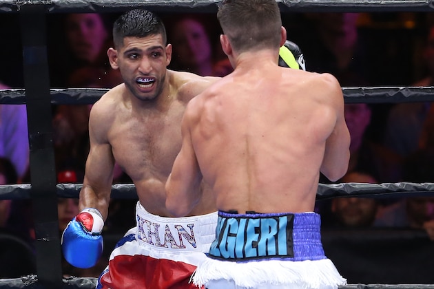 Amir Khan, left, fights against Chris Algieri during the eighth round of a boxing bout Friday, May 29, 2015, in New York. Khan won by unanimous decision. (AP Photo/Julia Weeks)