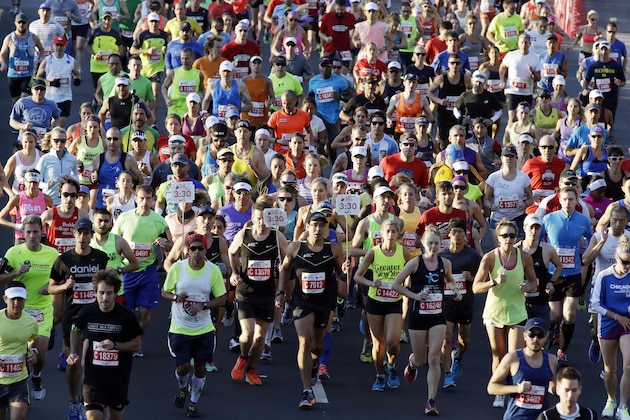 Runners participate in the Chicago Marathon, Sunday, Oct. 11, 2015, in Chicago. (AP Photo/Nam Y. Huh)