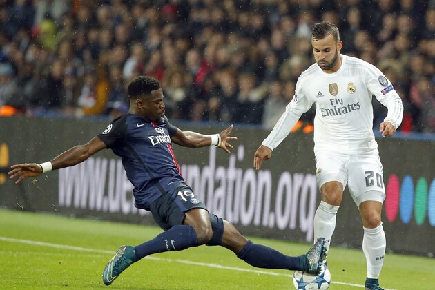 Real Madrid's Jese Rodriguez, right, is tackled by PSG's Serge Aurier during the Champions League group A soccer match between Paris St Germain and Real Madrid at the Parc des Princes stadium in Paris, Wednesday, Oct. 21, 2015. (AP Photo/Michel Euler)