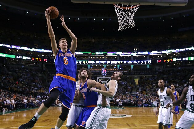 New York Knicks forward Kristaps Porzingis, of Latvia, (6) drives to the basket against the Boston Celtics during the first half of a preseason NBA basketball game in Boston, Thursday, Oct. 22, 2015. (AP Photo/Charles Krupa)