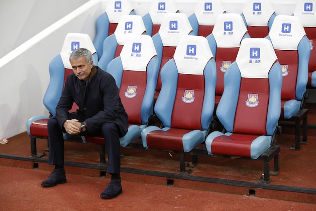 Chelsea's head coach Jose Mourinho waits for the match to start after taking his seat pitch side, prior to the start of the English Premier League soccer match between West Ham and Chelsea at Upton Park stadium in London, Saturday, Oct. 24, 2015.  (AP Photo/Matt Dunham)