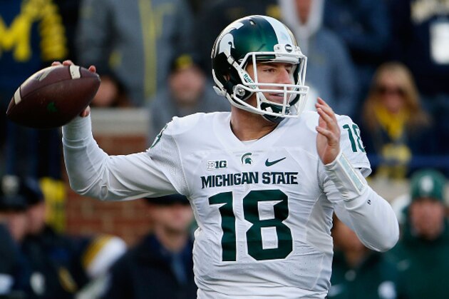 ANN ARBOR, MI - OCTOBER 17:  Quarterback Connor Cook #18 of the Michigan State Spartans throws a pass during the third quarter of the college football game against the Michigan Wolverines at Michigan Stadium on October 17, 2015 in Ann Arbor, Michigan.  The Spartans defeated the Wolverines 27-23.  (Photo by Christian Petersen/Getty Images)