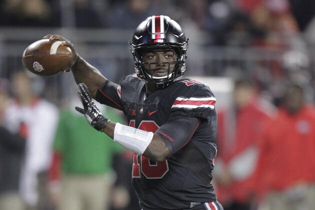 Ohio State quarterback J.T. Barrett drops back to pass against Penn State during the second half of an NCAA college football game Saturday, Oct. 17, 2015, in Columbus, Ohio. Ohio State beat Penn State 38-10. (AP Photo/Jay LaPrete)