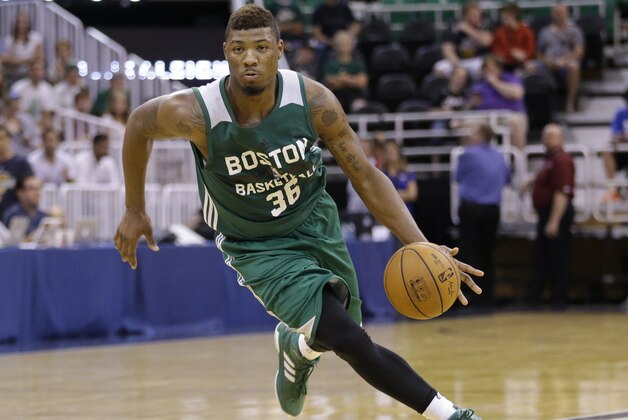 Boston Celtics' Marcus Smart (36) drives against the San Antonio Spurs during the second half of an NBA summer league basketball game Thursday, July 9, 2015, in Salt Lake City. (AP Photo/Rick Bowmer)