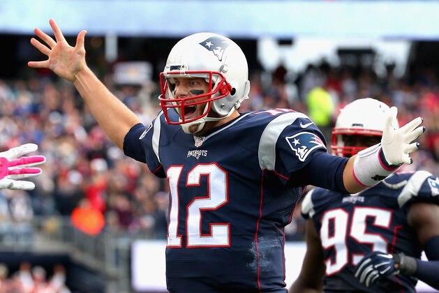 FOXBORO, MA - OCTOBER 25:  Tom Brady #12 of the New England Patriots reacts after throwing a touchdown pass during the fourth quarter against the New York Jets at Gillette Stadium on October 25, 2015 in Foxboro, Massachusetts.  (Photo by Jim Rogash/Getty Images)