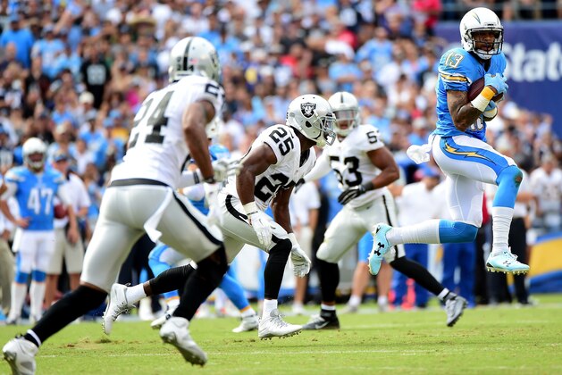 SAN DIEGO, CA - OCTOBER 25:   Keenan Allen #13 of the San Diego Chargers makes a catch for a first down past  D.J. Hayden #25 of the Oakland Raiders during the first quarter at Qualcomm Stadium on October 25, 2015 in San Diego, California.  (Photo by Harry How/Getty Images)