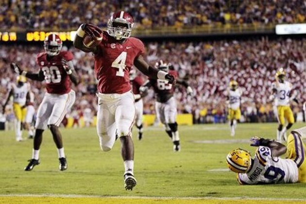 Alabama running back T.J. Yeldon (4) scores the winning touchdown past LSU defensive end Barkevious Mingo (49) in the second half of their NCAA college football game in Baton Rouge, La., Saturday, Nov. 3, 2012. Alabama won 21-17. (AP Photo/Gerald Herbert)