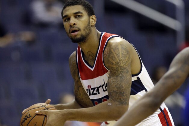 Washington Wizards guard Glen Rice Jr. (14) holds the ball in the second half of a preseason NBA basketball game against the Detroit Pistons Sunday, Oct. 12, 2014 in Washington. The Wizards won 91-89. (AP Photo/Alex Brandon)