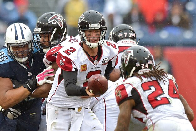 Oct 25, 2015; Nashville, TN, USA; Atlanta Falcons quarterback Matt Ryan (2) hands off to Falcons running back Devonta Freeman (24) during the second half against the Tennessee Titans at Nissan Stadium. Atlanta won 10-7. Mandatory Credit: Jim Brown-USA TODAY Sports