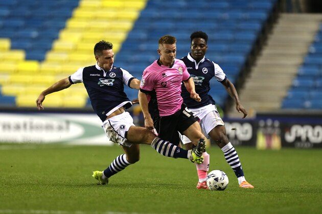LONDON, ENGLAND - OCTOBER 06:  Sam Hoskins of Northampton Town attempts to move past the challenge of Lee Martin of Millwall during the Johnstone's Paint Trophy  Second Round match between Millwall and Northampton Town at The Den on October 6, 2015 in London, England.  (Photo by Pete Norton/Getty Images)