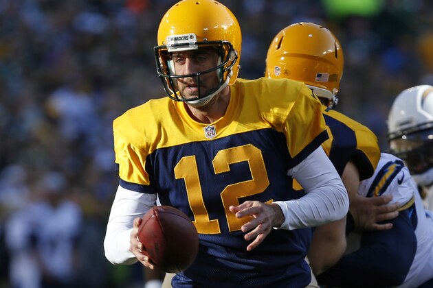 Green Bay Packers quarterback Aaron Rodgers (12) in action during the first half of an NFL football game against the San Diego Chargers, Sunday, Oct. 18, 2015, in Green Bay, Wis. (AP Photo/Mike Roemer)
