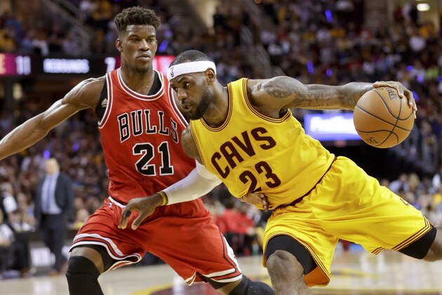 Cleveland Cavaliers forward LeBron James (23) drives against Chicago Bulls guard Jimmy Butler (21) during the first half of Game 2 in a second-round NBA basketball playoff series Wednesday, May 6, 2015, in Cleveland. (AP Photo/Tony Dejak)