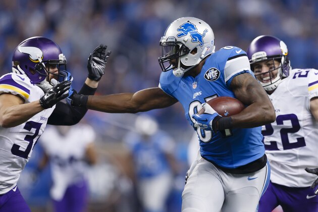 Detroit Lions wide receiver Calvin Johnson (81) stiff arms Minnesota Vikings strong safety Andrew Sendejo (34) during the first half of an NFL football game, Sunday, Oct. 25, 2015, in Detroit. (AP Photo/Rick Osentoski)