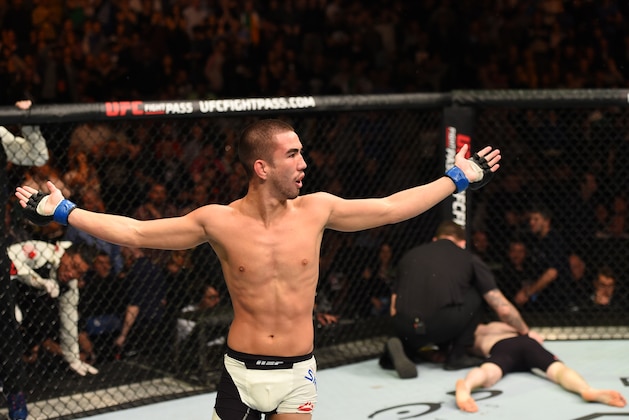 DUBLIN, IRELAND - OCTOBER 24:  (L-R) Louis Smolka celebrates his submission victory over Paddy Holohan in their flyweight fight during the UFC event at 3Arena on October 24, 2015 in Dublin, Ireland. (Photo by Josh Hedges/Zuffa LLC/Zuffa LLC via Getty Images)
