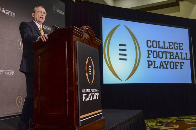 Jeff Long, College Football Playoff selections committee chairman, discusses the selection process of the semifinal pairings and semifinal bowl assignments during a news conference Sunday, Dec. 7, 2014, in Grapevine, Texas.   (AP Photo/Tim Sharp)