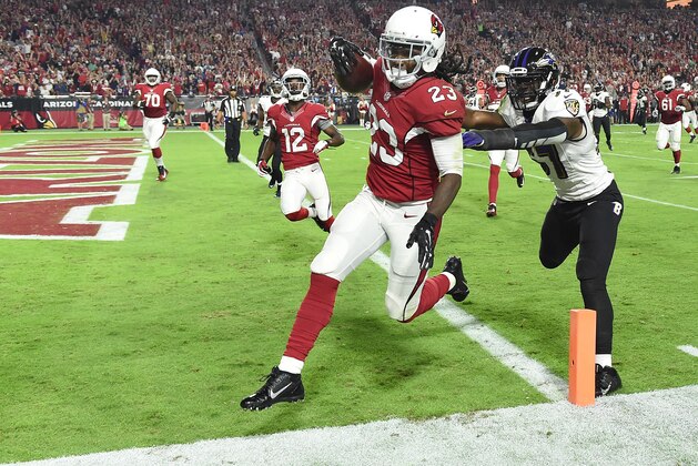 GLENDALE, AZ - OCTOBER 26: Running back Chris Johnson #23 of the Arizona Cardinals runs in a 26 yard touchdown against linebacker C.J. Mosley #57 of the Baltimore Ravens in the first quarter of the NFL game at University of Phoenix Stadium on October 26, 2015 in Glendale, Arizona. (Photo by Norm Hall/Getty Images) GLENDALE, AZ - OCTOBER 26: Running back Chris Johnson #23 of the Arizona Cardinals runs in a 26 yard touchdown against linebacker C.J. Mosley #57 of the Baltimore Ravens in the first quarter of the NFL game at University of Phoenix Stadium on October 26, 2015 in Glendale, Arizona. (Photo by Norm Hall/Getty Images)