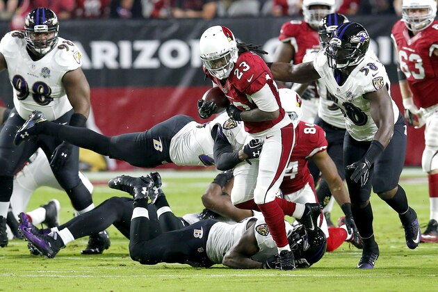 Arizona Cardinals running back Chris Johnson (23) runs against the Baltimore Ravens during the first half of an NFL football game, Monday, Oct. 26, 2015, in Glendale, Ariz. (AP Photo/Rick Scuteri)
