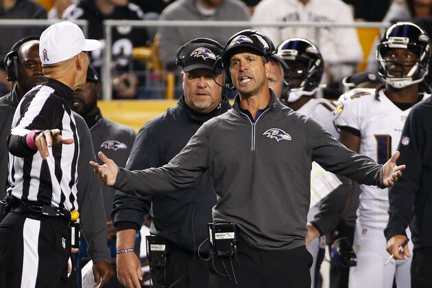 Baltimore Ravens head coach John Harbaugh, right, talks with referee Clete Blakeman during the first half of an NFL football game against the Pittsburgh Steelers, Thursday, Oct. 1, 2015 in Pittsburgh. (AP Photo/Gene J. Puskar)
