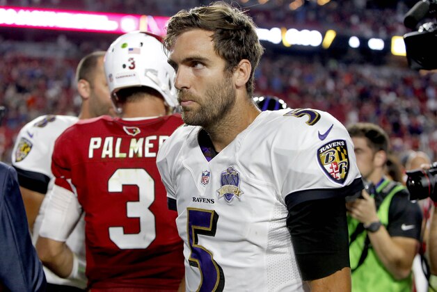 Baltimore Ravens quarterback Joe Flacco (5) walks away after greeting Arizona Cardinals quarterback Carson Palmer (3) at midfield after an NFL football game, Monday, Oct. 26, 2015, in Glendale, Ariz. The Cardinals won 26-18. (AP Photo/Rick Scuteri)