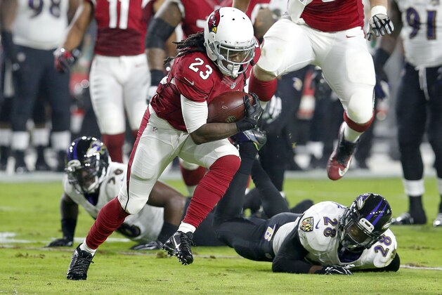 Arizona Cardinals running back Chris Johnson (23) runs for a touchdown against the Baltimore Ravens during the first half of an NFL football game, Monday, Oct. 26, 2015, in Glendale, Ariz. (AP Photo/Rick Scuteri)