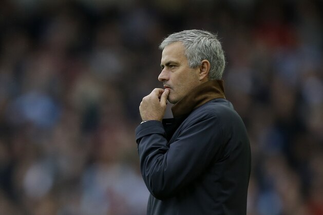 Chelsea's head coach Jose Mourinho  gestures after his player Nemanja Matic was sent off for receiving a second yellow card during the English Premier League soccer match between West Ham and Chelsea at Upton Park stadium in London, Saturday, Oct. 24, 2015.  (AP Photo/Matt Dunham)