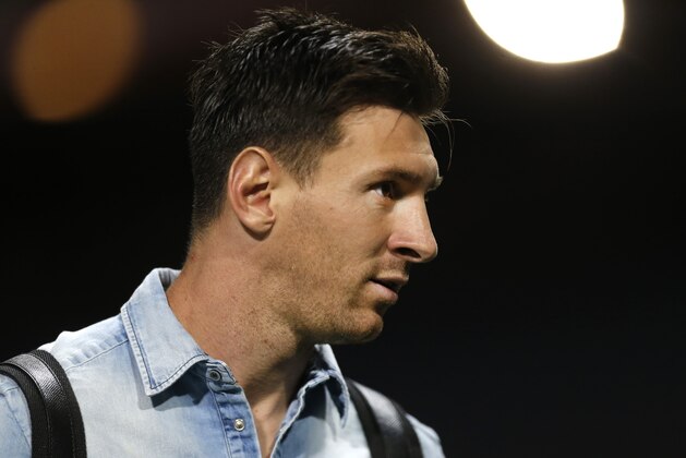 Barcelona's Lionel Messi leaves after a Spanish La Liga soccer match between Atletico Madrid and Barcelona at the Vicente Calderon stadium in Madrid, Saturday, Sept. 12, 2015. Messi scored once in Barcelona's 2-1 victory. (AP Photo/Francisco Seco)